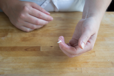 9. To make the spout of the teapot use a small amount of fondant create a curved shape with a point on one end and flatten it on the other end.