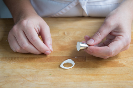 16. Make a tea cup saucer by rolling out a small amount of fondant and cutting small circles with a piping tip. Place the cup on the saucer with a little bit of water.