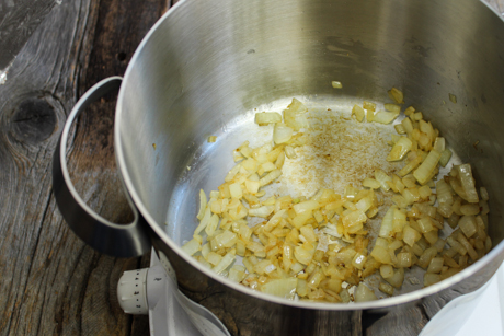 4. Fry onions in a large pot over medium-high heat with vegetable oil until cooked. About 5-7 minutes.