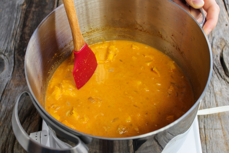 8. Pour the coconut milk and vegetable stock over the pumpkin and bring to a boil and simmer for 10-15 minutes.