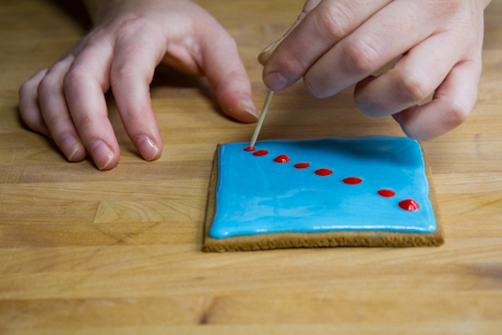 Using a toothpick to marble royal icing