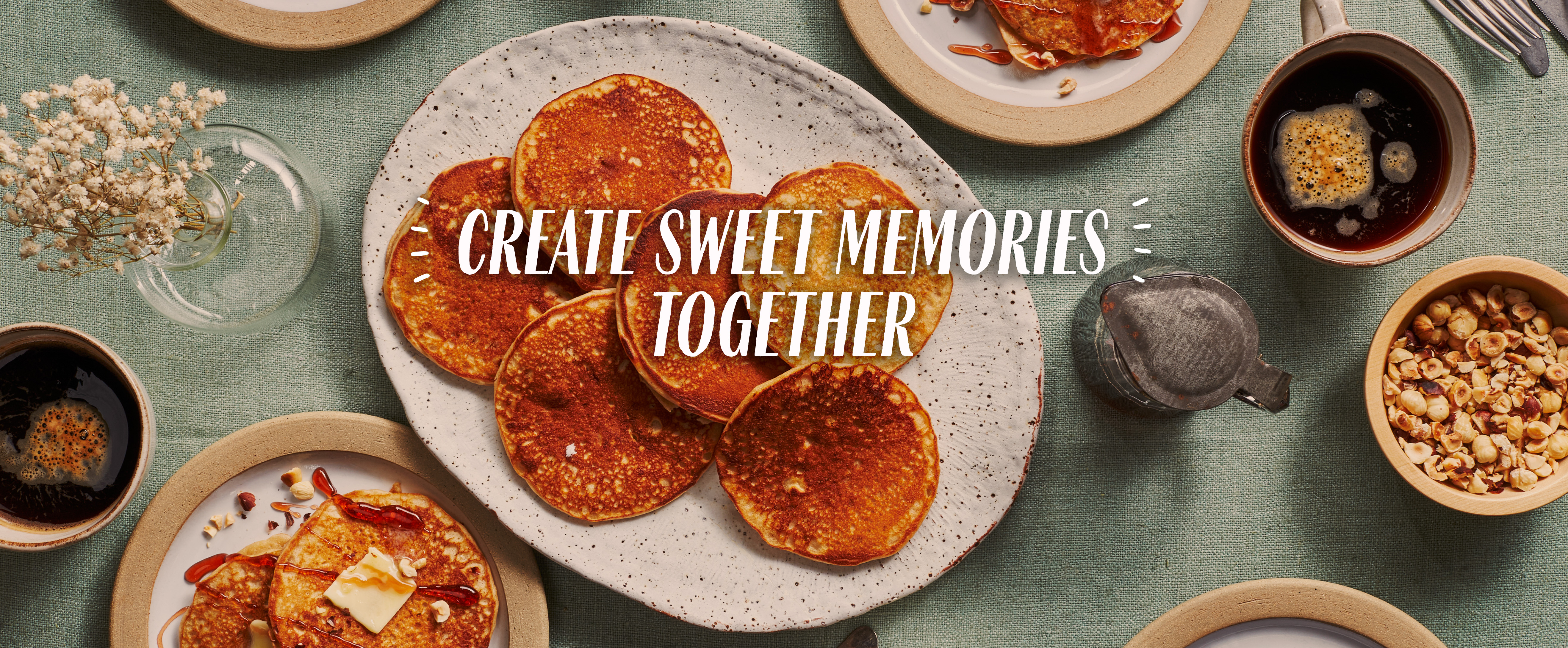 A stack of pancakes with text Create Sweet Memories Together