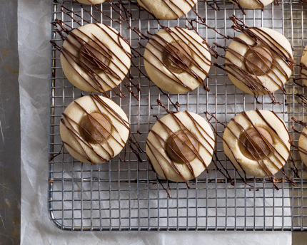 Chestnut Thumbprint Cookies on a wire cooling rack