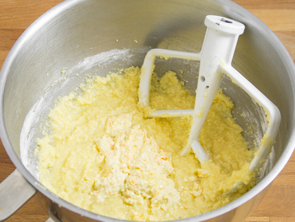 Mixer bowl of light coloured batter and a paddle attachment
