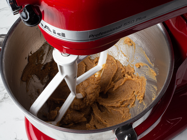 Creamed brown sugar, melted butter, vanilla extract, almond extract, and salt in a stand mixer bowl