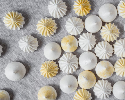 Shimmering Meringue Kisses on a grey background