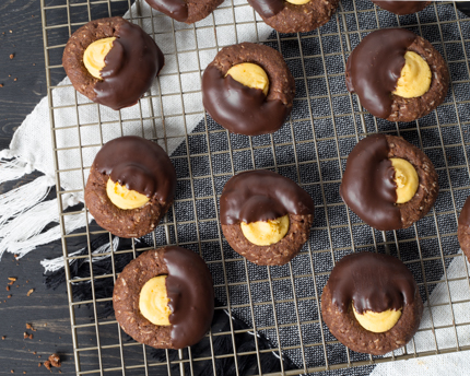 Nanaimo Thumbprint Cookies on a wire cooling rack