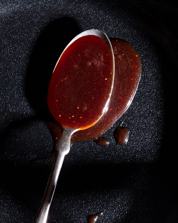 Spoonful of strawberry-wine caramel sauce