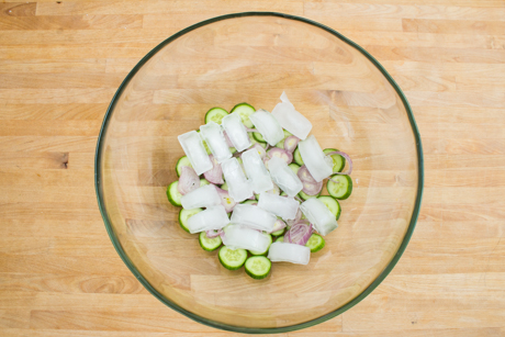 Ice cubes on cucumber and shallots