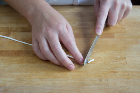 9. To make the spout of the teapot use a small amount of fondant create a curved shape with a point on one end and flatten it on the other end.