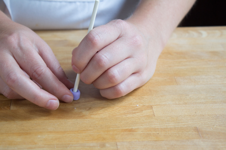 14. To make a little tea cup start with a small log and flatten each side. Using a cake-pop stick gently poke a little hole in one end of the cup. Set aside.