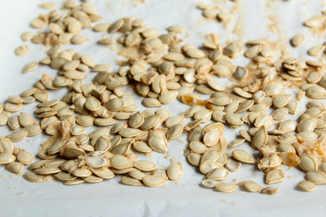 4. Place seeds on baking tray making sure they are in an even layer on the tray.