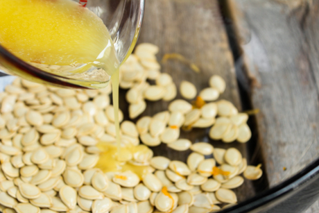 3. In a medium sized bowl toss the seeds with melted butter, cinnamon sugar, and salt.