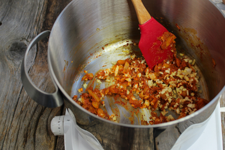 6. Now, add the chopped garlic, and ginger. Cook for another 2-4 minutes. Set aside until pumpkin is cooked.