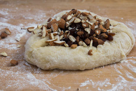 Knead the nuts and dried fruit into the dough