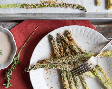 Asparagus Fries with Chipotle Dip on a white plate with a fork