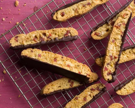 Chocolate dipped biscotti on a wire cooling rack