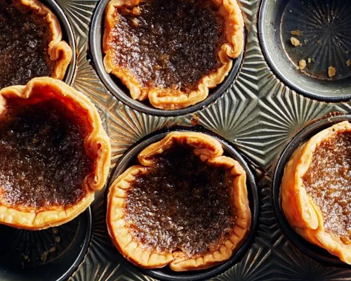 Classic butter tarts in a muffin pan