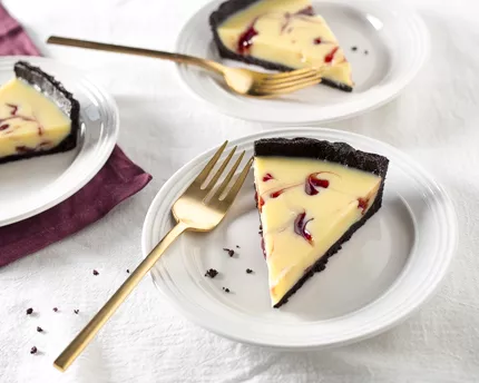 White Chocolate Raspberry Swirl Tart with a Dark Chocolate Crust