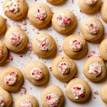 Peppermint thumbprint cookies decorated with crushed candy canes