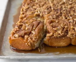 Apple, Walnut, and Caramel Buns on a baking sheet