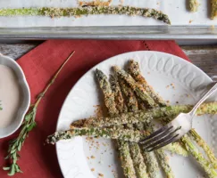 Asparagus Fries with Chipotle Dip on a white plate with a fork