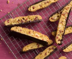 Chocolate dipped biscotti on a wire cooling rack