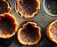 Classic butter tarts in a muffin pan