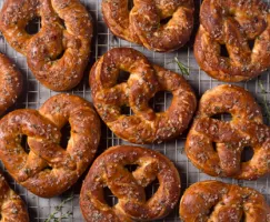 Baked pretzels cooling on a wire rack