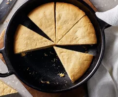 Sugar cookie cut into wedges in a skillet