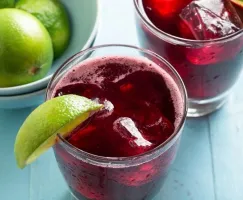 Red Sorrel Drink garnished with a lime slice