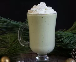 Mug of eggless eggnog topped with whipped cream