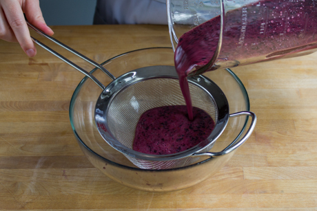 5. Pour blended blueberry mixture into strainer